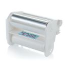A Xyron Create-A-Sticker 500 Permanent Refill Cartridge with a clear and white plastic design, featuring visible adhesive and backing rolls.
