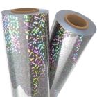 Two rolls of Sparkle Silver Holographic Laminating / Toner Fusing Foil with a vibrant, shimmering pattern reflecting colorful light.