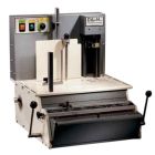 A Rhin-O-Tuff HD7700P Heavy Duty Binding Punch machine with controls and levers, designed for industrial-scale bookbinding tasks.