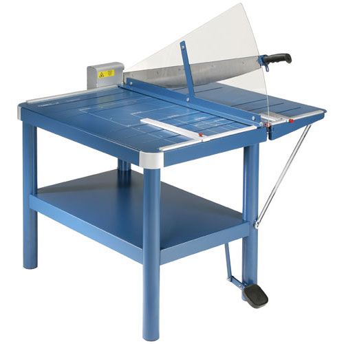 A Dahle 580 32" Premium Guillotine Style Ream Cutter, featuring a sturdy blue table design with a clear safety guard and foot-operated clamp for precise large-format cutting.