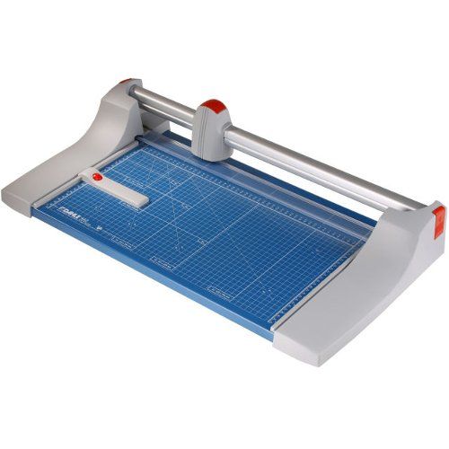 A Dahle Model 442 Premium Rolling Trimmer featuring a blue grid cutting mat and rotary blade for precision paper trimming.