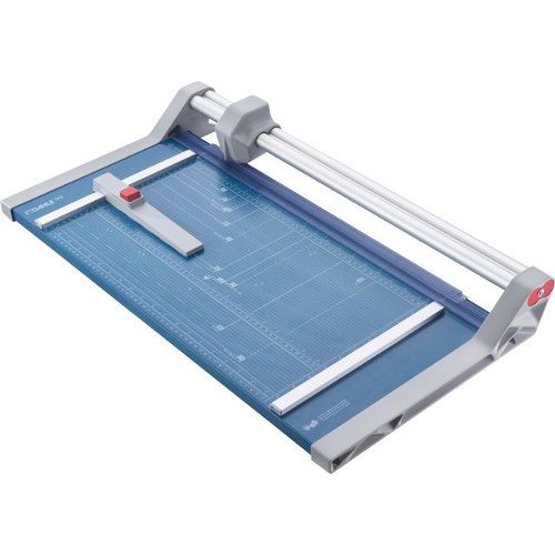 A top view of the Dahle Model 552 Professional Rolling Trimmer, featuring a blue cutting surface, measurement grid, and a sliding blade mechanism for precise trimming.