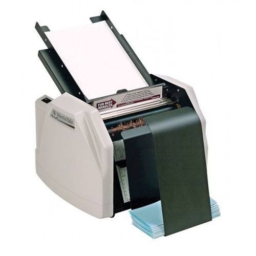 Martin Yale 1501X AutoFolder Paper Folding Machine shown with a stack of paper loaded and folded sheets outputted below.