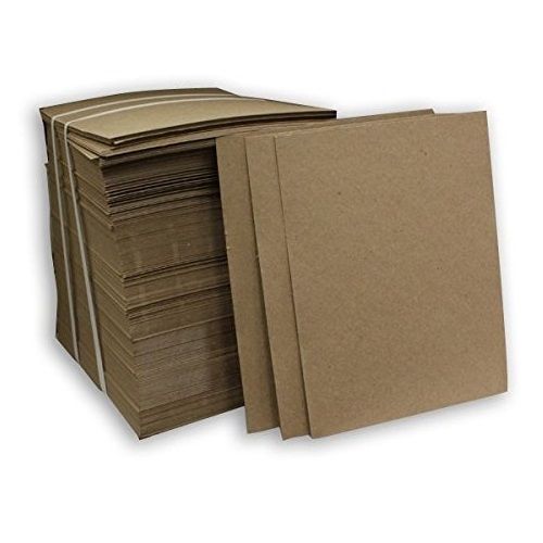 A stack of thin, rectangular brown .024pt Padding Chipboards neatly arranged in bundles, with some individual sheets propped upright to display their smooth and uniform texture.