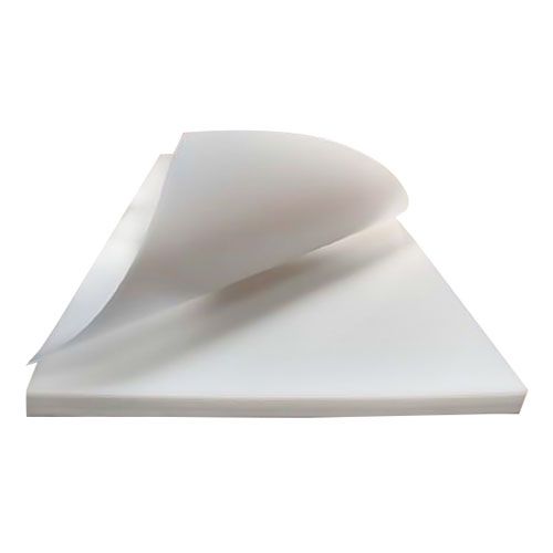 A close-up view of a plain white Rhino Self-Healing Large Cutting Mat (No Grid) with a slightly curled edge, showcasing its smooth and uniform surface.