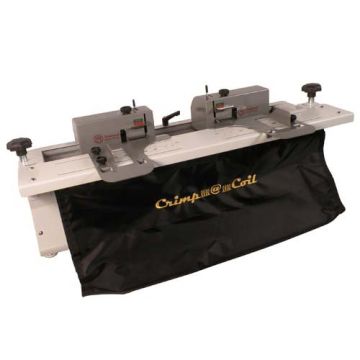 Akiles Crimp@Coil Heavy Duty Automatic Coil Crimper machine with dual crimping heads and a black catch bag, used for efficiently crimping coil binding spines.