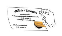 A hand is holding a corner of a Certificate of Achievement, revealing a foil-laminated section.