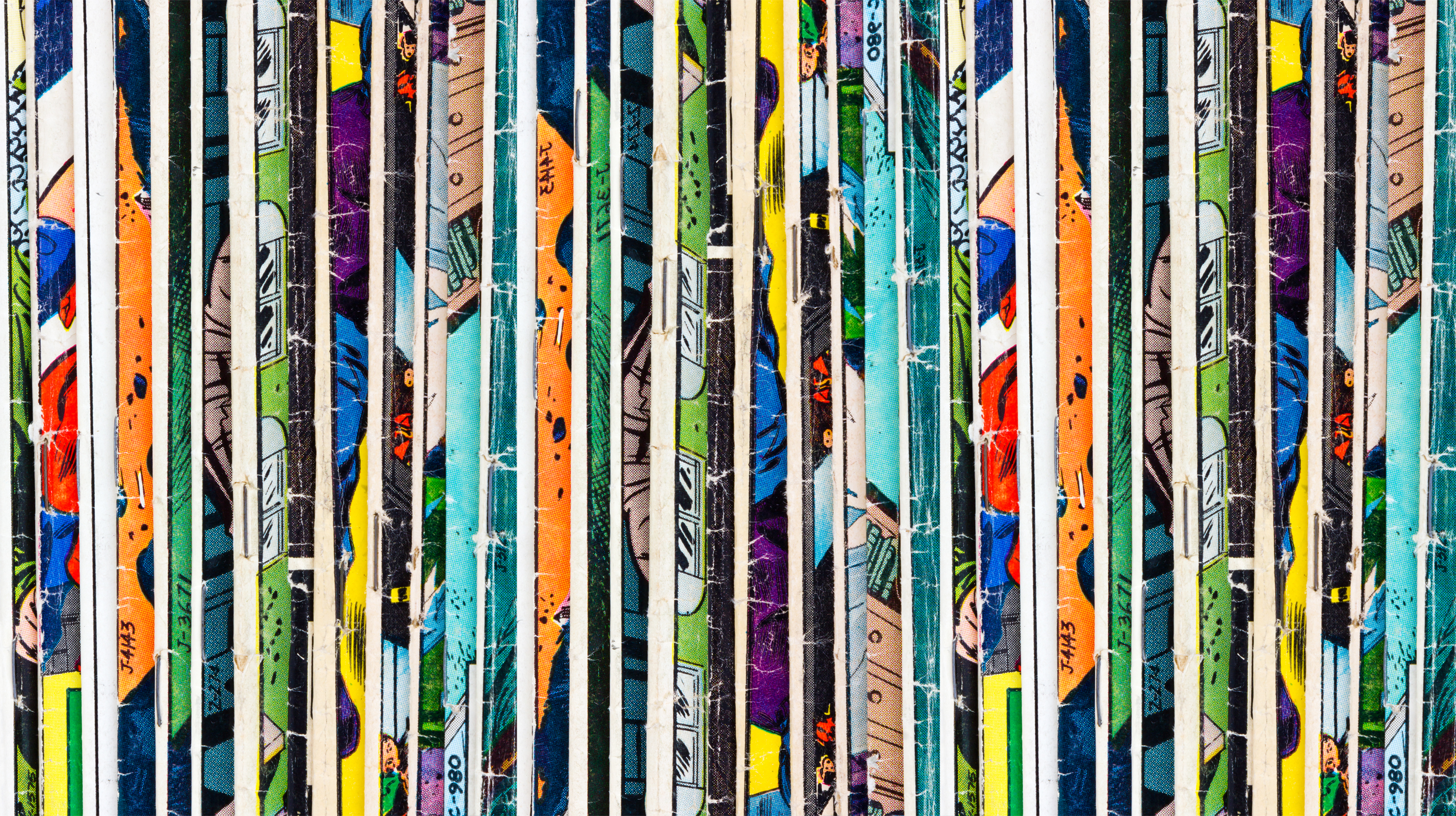 Shelf of handmade comic spines