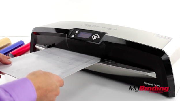 Running laminating pouch through laminator