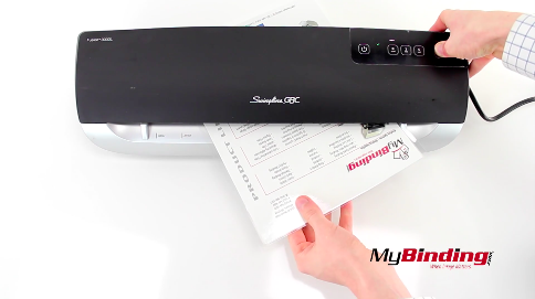 Trying to pull a laminating pouch out of the laminator