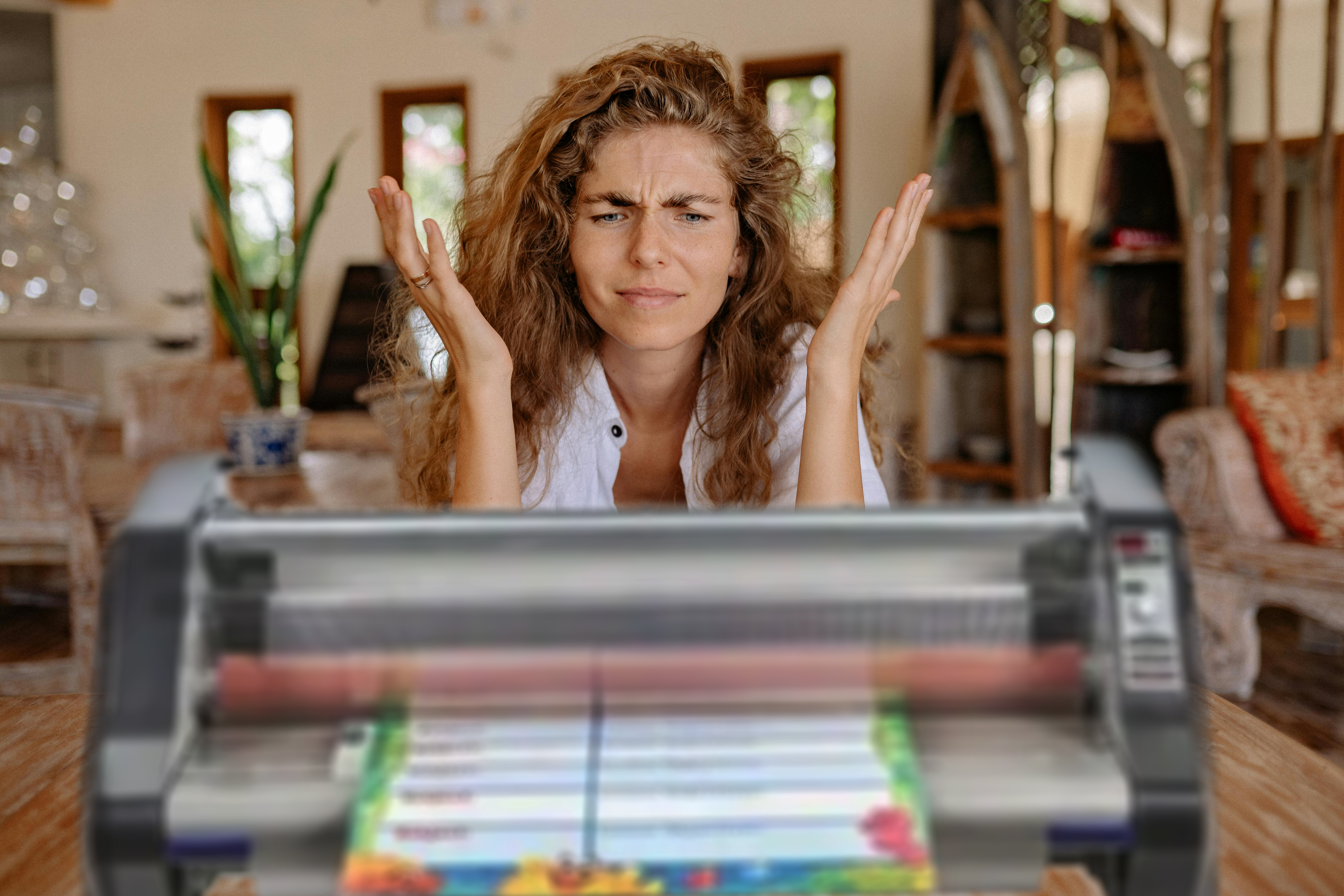 woman frustrated with broken laminator